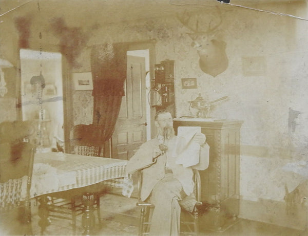 Antique Photograph Interio, Telephone, Deer Mount & Pipe Smoking Man